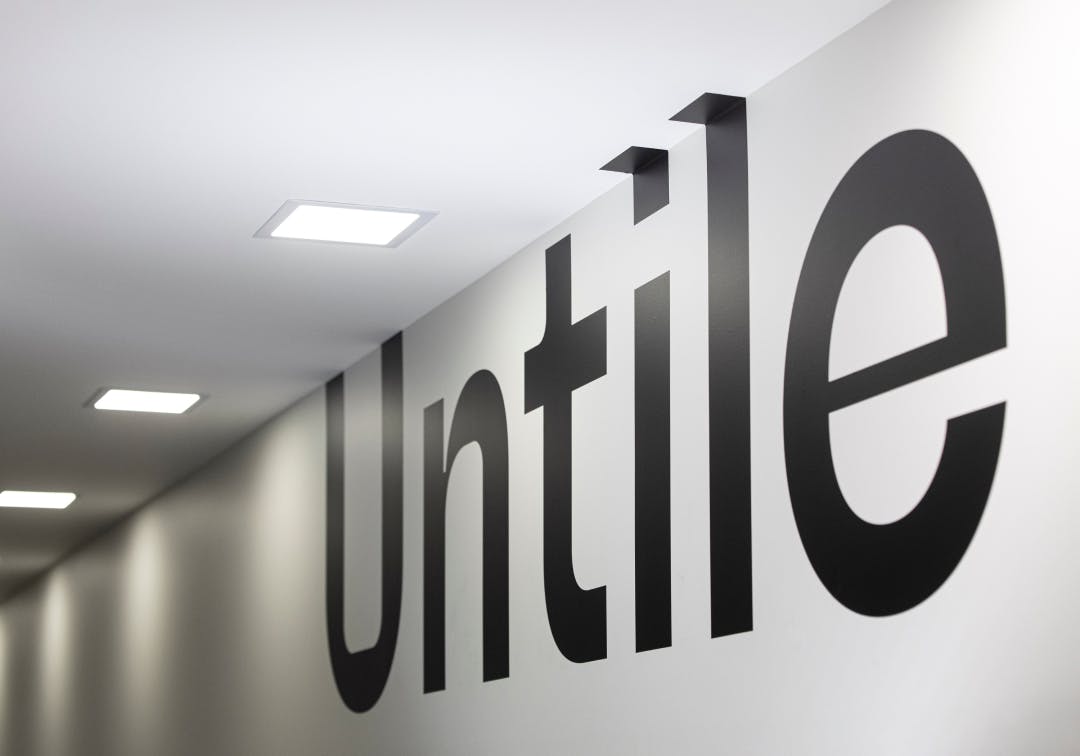 The untile logo on the office walls